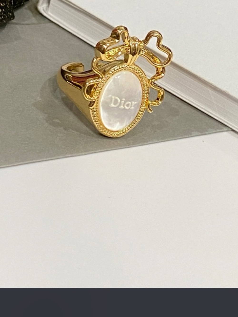 Dior. Gold Tone Faux Mother of Pearl BOW Signature Ring